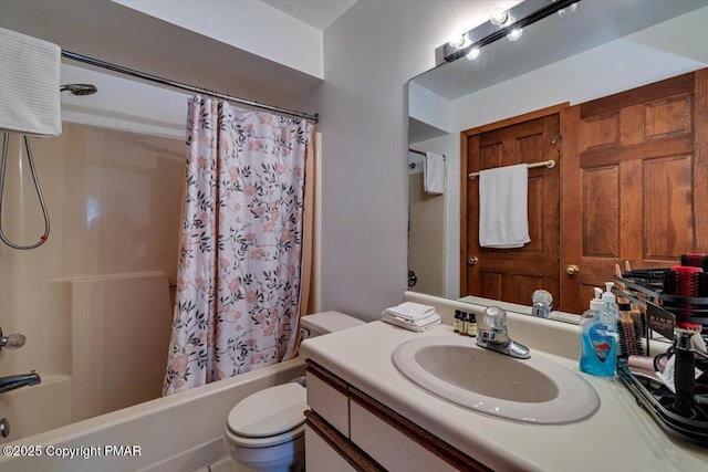 bathroom with shower / bathtub combination with curtain, toilet, and vanity