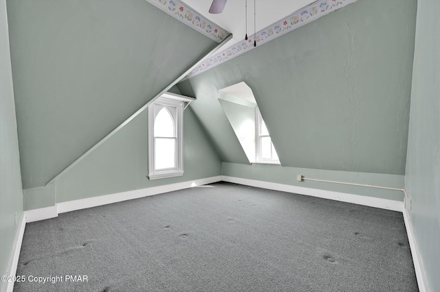 bonus room featuring carpet floors, ceiling fan, baseboards, and lofted ceiling