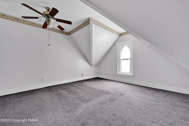 bonus room featuring lofted ceiling, carpet, baseboards, and ceiling fan