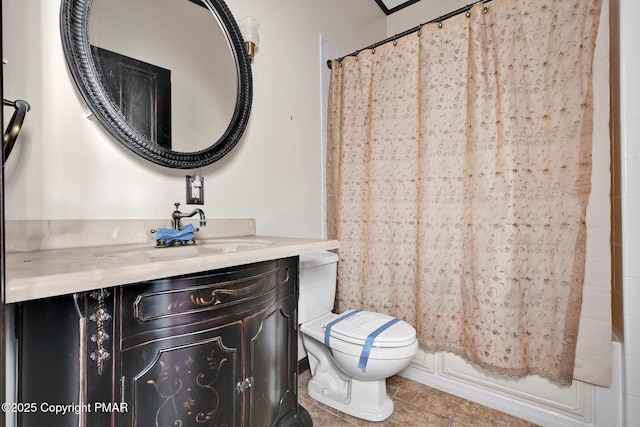 bathroom featuring a shower with shower curtain, vanity, toilet, and tile patterned floors