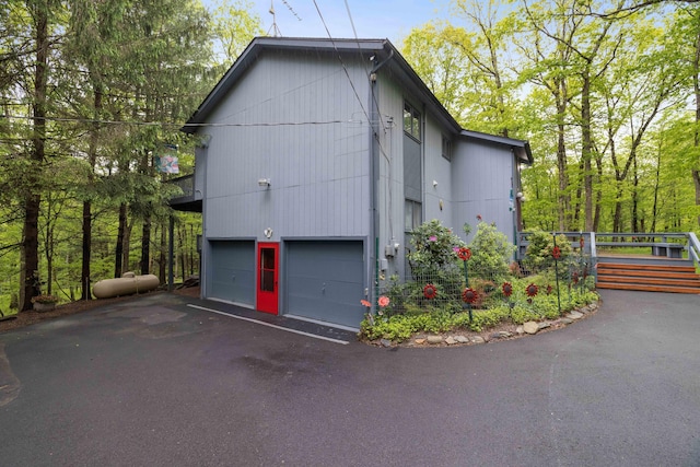 151 Forest Dr, Canadensis, PA 18325 - view of side of property with driveway and an attached garage