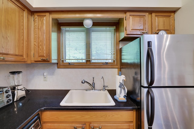 151 Forest Dr, Canadensis, PA 18325 - kitchen with freestanding refrigerator, a sink, dark countertops, backsplash, and dishwashing machine
