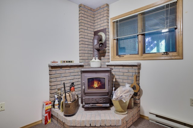 151 Forest Dr, Canadensis, PA 18325 - detailed view of baseboard heating, a wood stove, baseboards, and carpet flooring