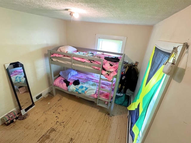 375 N Courtland St, East Stroudsburg, PA 18301 - bedroom with a textured ceiling and hardwood / wood-style floors