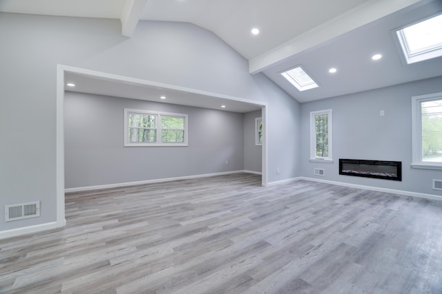 1005 Country Place Dr, Coolbaugh Township, PA 18466 - unfurnished living room with a skylight, plenty of natural light, recessed lighting, beamed ceiling, and wood finished floors