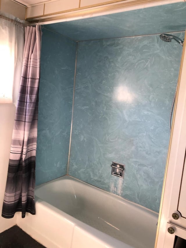 bathroom featuring shower / bathtub combination with curtain