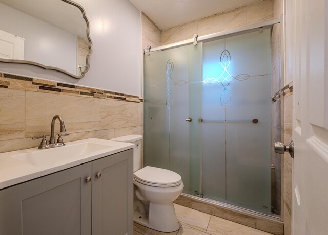 5104 Lake Dr, East Stroudsburg, PA 18301 - full bathroom featuring a shower stall, vanity, and tile walls
