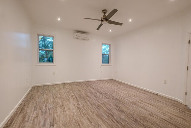 5104 Lake Dr, East Stroudsburg, PA 18301 - unfurnished room with a wall mounted air conditioner, wood finished floors, ceiling fan, and recessed lighting