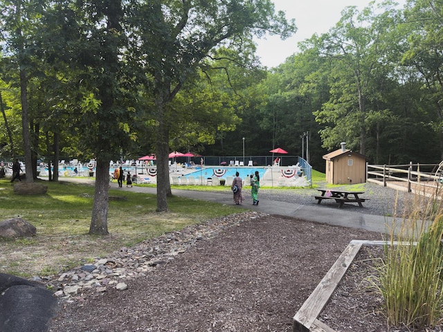 5104 Lake Dr, East Stroudsburg, PA 18301 - view of home's community featuring a storage unit and a swimming pool