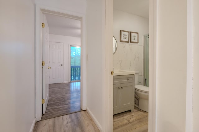 5104 Lake Dr, East Stroudsburg, PA 18301 - hallway with light wood finished floors and tile walls