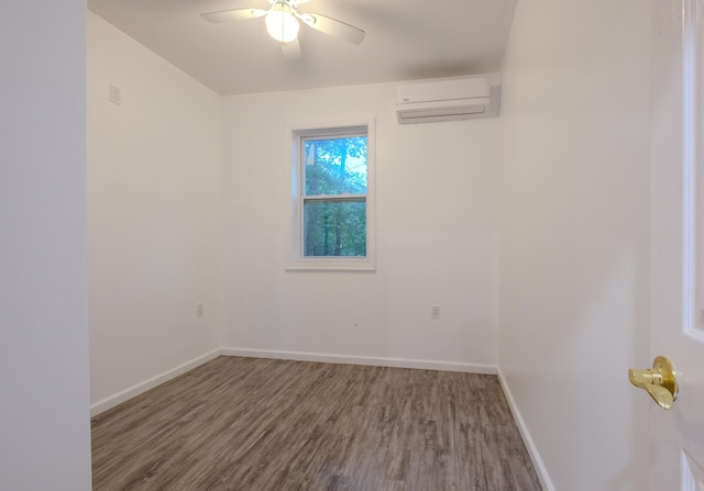5104 Lake Dr, East Stroudsburg, PA 18301 - empty room with an AC wall unit, wood finished floors, and ceiling fan