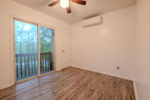 5104 Lake Dr, East Stroudsburg, PA 18301 - spare room with a wall mounted air conditioner, wood finished floors, and a ceiling fan