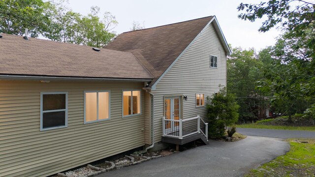 5104 Lake Dr, East Stroudsburg, PA 18301 - back of property with roof with shingles and french doors