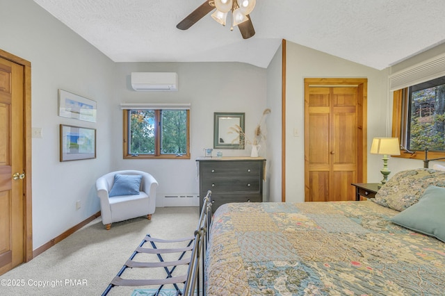 bedroom with lofted ceiling, carpet flooring, a textured ceiling, baseboard heating, and a wall mounted AC