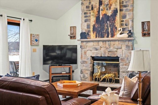 living room with lofted ceiling and a fireplace