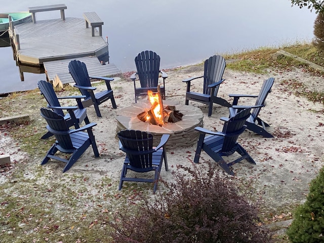 exterior space with a fire pit and a boat dock