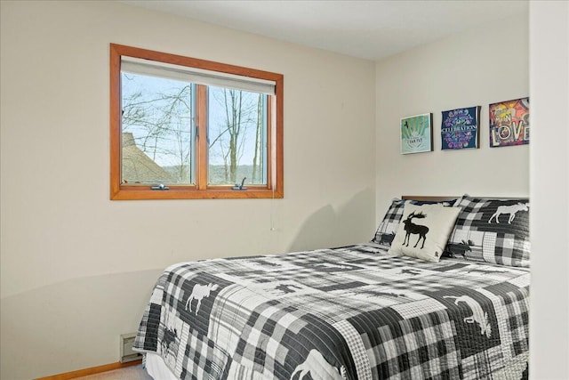 carpeted bedroom with baseboards