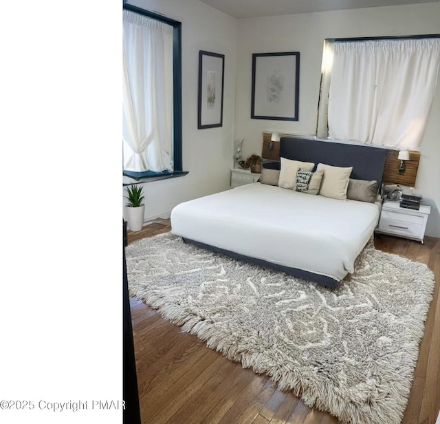 bedroom featuring wood finished floors
