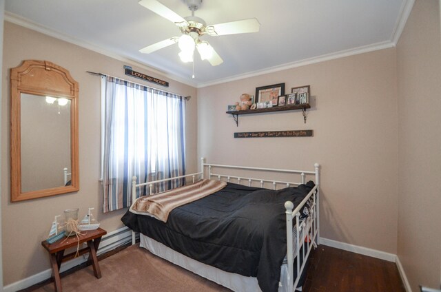 bedroom with ceiling fan, ornamental molding, wood finished floors, and baseboards