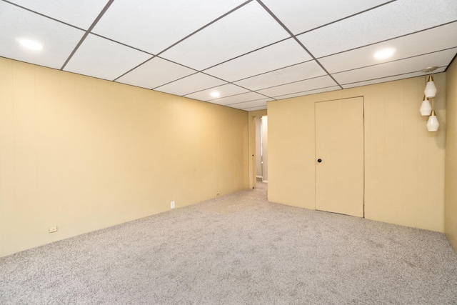 finished below grade area with carpet and a drop ceiling