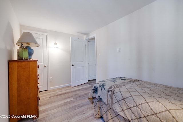 bedroom with light wood-type flooring