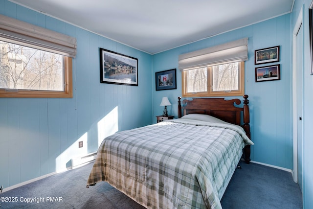 carpeted bedroom with a baseboard radiator