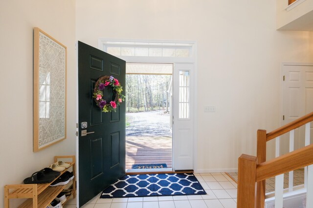355 Windy Bush Rd, Pocono Pines, PA 18350 - entryway with light tile patterned floors and stairs