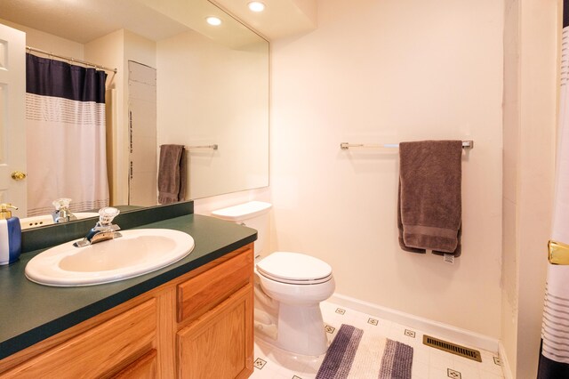 355 Windy Bush Rd, Pocono Pines, PA 18350 - full bath with baseboards, vanity, toilet, recessed lighting, and a shower with shower curtain
