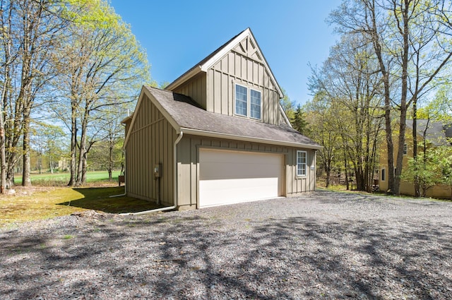 355 Windy Bush Rd, Pocono Pines, PA 18350 - view of side of home with board and batten siding and a shingled roof