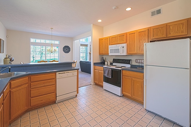 355 Windy Bush Rd, Pocono Pines, PA 18350 - kitchen featuring white appliances, a sink, dark countertops, recessed lighting, and light tile patterned floors