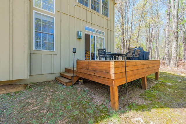355 Windy Bush Rd, Pocono Pines, PA 18350 - view of exterior entry featuring board and batten siding and a wooden deck