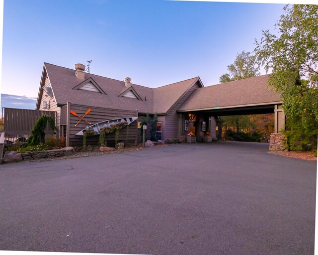 355 Windy Bush Rd, Pocono Pines, PA 18350 - view of front facade with asphalt driveway and a chimney