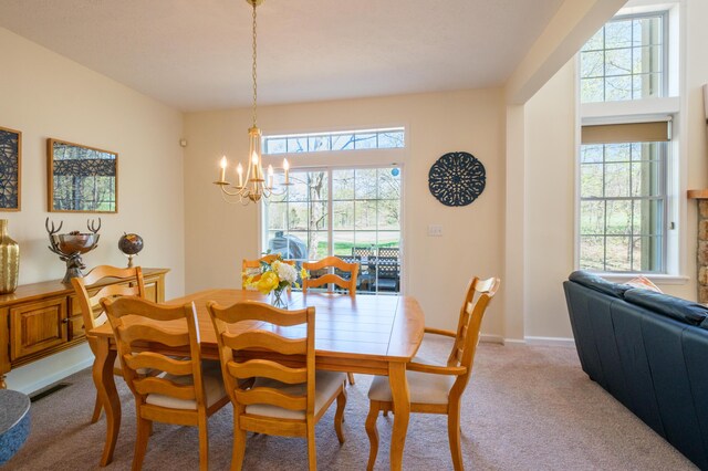 355 Windy Bush Rd, Pocono Pines, PA 18350 - dining space featuring a chandelier, light carpet, plenty of natural light, and baseboards
