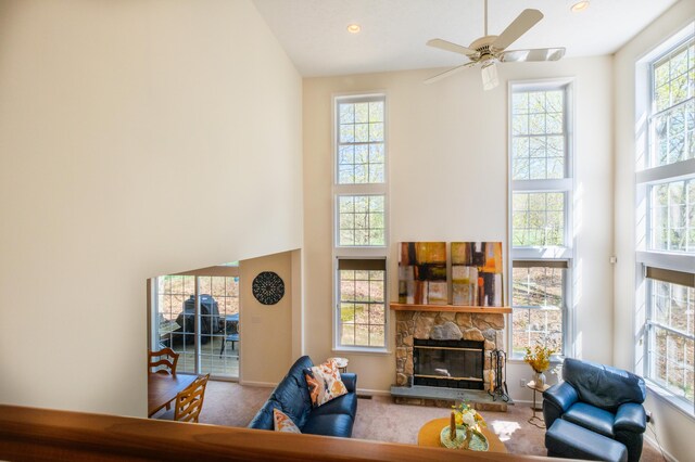 355 Windy Bush Rd, Pocono Pines, PA 18350 - carpeted living room with a high ceiling, baseboards, a fireplace, a ceiling fan, and recessed lighting