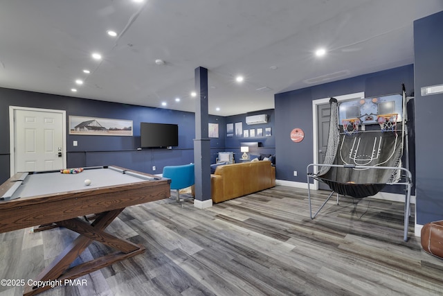 recreation room with baseboards, wood finished floors, pool table, a wall mounted air conditioner, and recessed lighting