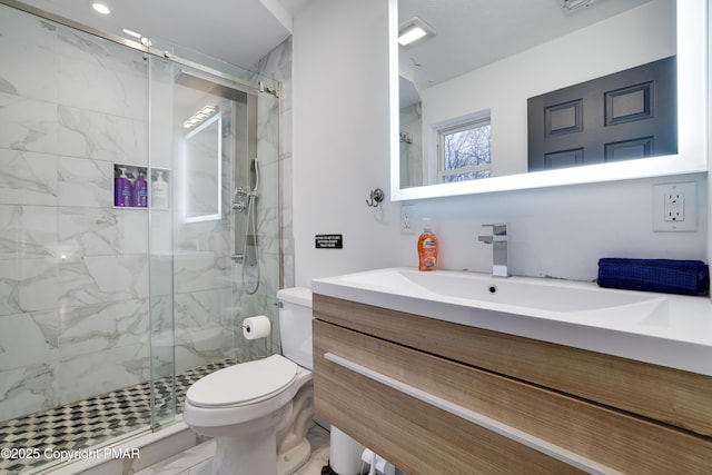 bathroom with toilet, marble finish floor, a marble finish shower, and vanity