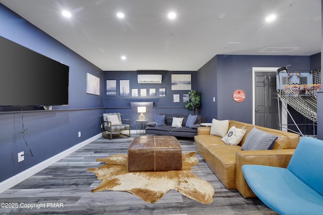 living room with recessed lighting, baseboards, wood finished floors, and a wall mounted AC