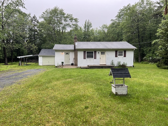 171 Linden Loop, Pocono Summit, PA 18346 - single story home with a carport, a chimney, a front yard, gravel driveway, and a garage