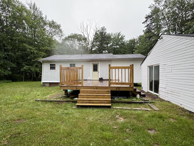 171 Linden Loop, Pocono Summit, PA 18346 - rear view of house with a wooden deck and a lawn