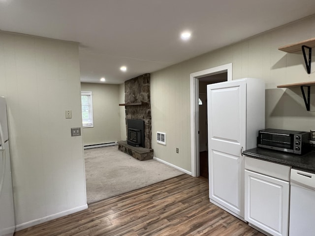 171 Linden Loop, Pocono Summit, PA 18346 - kitchen featuring open shelves, baseboard heating, dark countertops, dark wood-style floors, and dishwasher