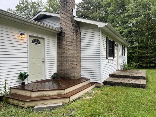 171 Linden Loop, Pocono Summit, PA 18346 - entrance to property with a chimney and a lawn