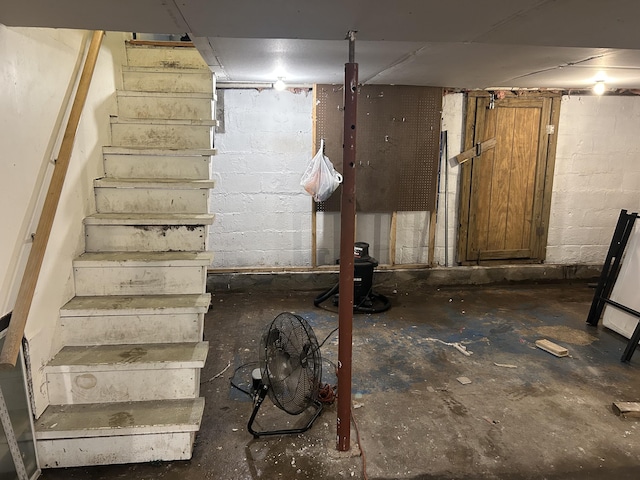 22 Quay Ave, Mount Pocono, PA 18344 - unfinished basement featuring stairway and concrete block wall