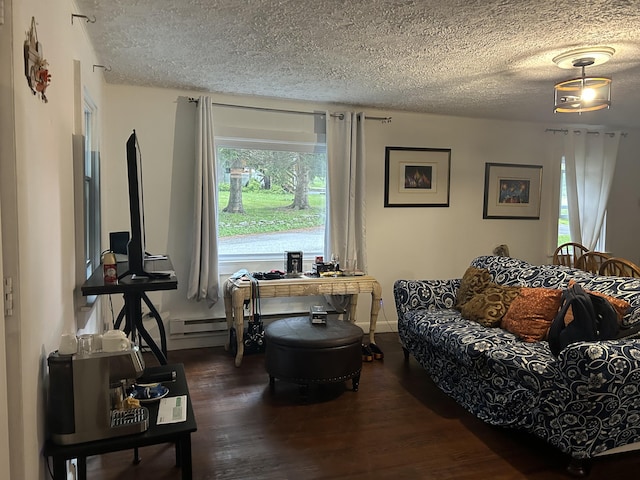 22 Quay Ave, Mount Pocono, PA 18344 - living room with a textured ceiling, wood finished floors, and a baseboard heating unit