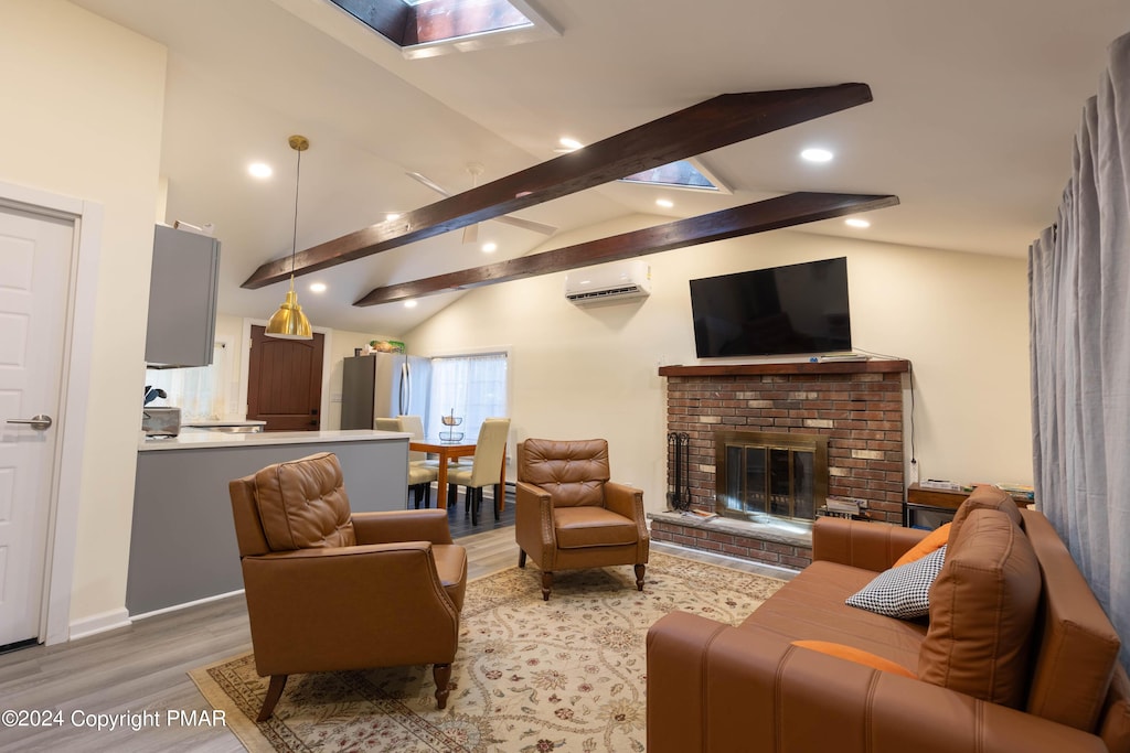 living room with vaulted ceiling with beams, a fireplace, recessed lighting, light wood-style flooring, and a wall mounted air conditioner