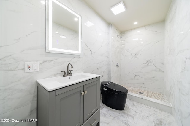 full bathroom featuring marble finish floor, tile walls, recessed lighting, vanity, and walk in shower