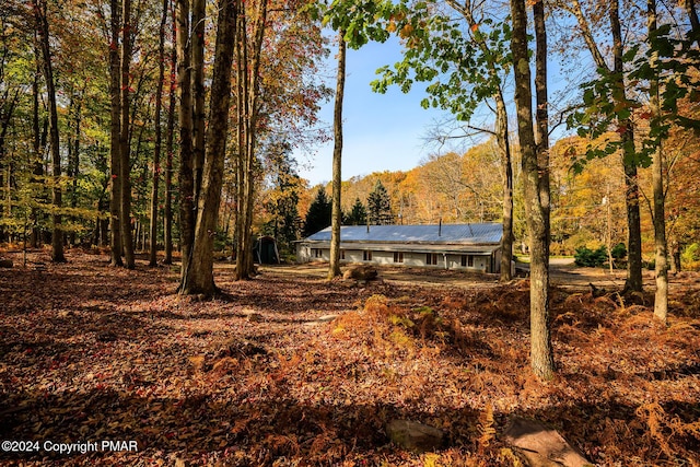 exterior space with a forest view