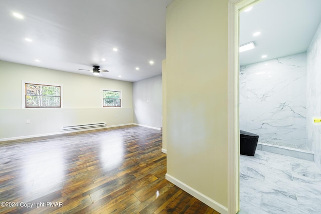 spare room with ceiling fan, hardwood / wood-style floors, baseboard heating, and recessed lighting