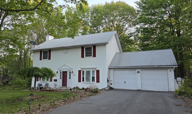 34 Heath Ln, Mount Pocono, PA 18344 - colonial-style house featuring a chimney, an attached garage, and asphalt driveway