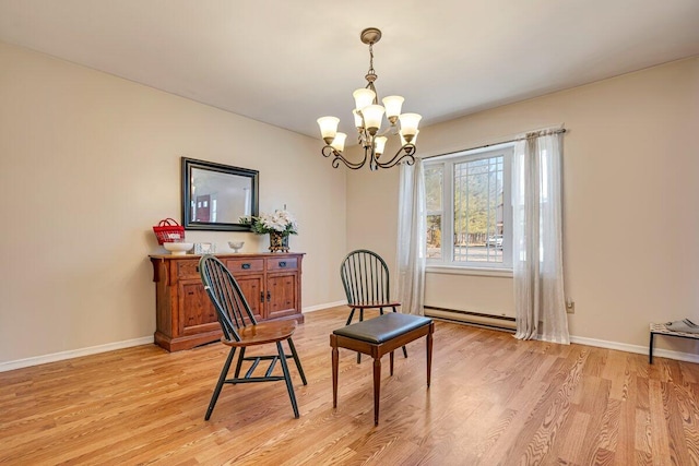 34 Heath Ln, Mount Pocono, PA 18344 - living area with a baseboard radiator, a chandelier, light wood-type flooring, and baseboards