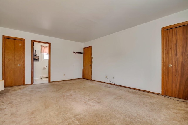34 Heath Ln, Mount Pocono, PA 18344 - empty room with light carpet, a baseboard radiator, and baseboards